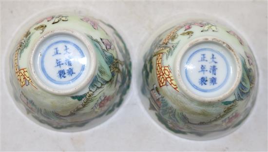 A pair of Chinese famille boys cups, Yongzheng marks, 18th/19th century, diameter 6.25cm, restored